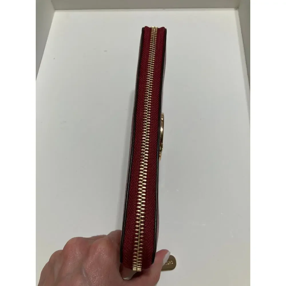 MICHAEL KORS, LARGE RED PEBBLED LEATHER WALLET